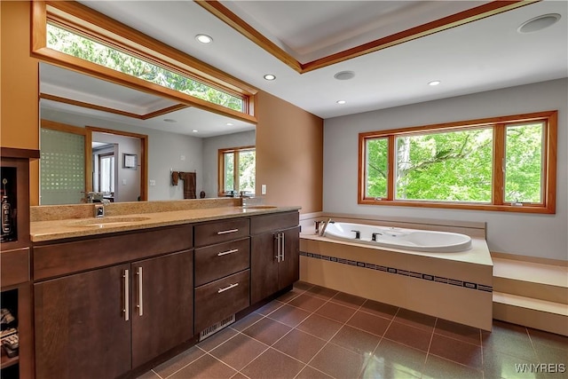 9325 Hunting Valley Rd N, Clarence, NY 14031 - bathroom with double vanity, a whirlpool tub, recessed lighting, and a tray ceiling