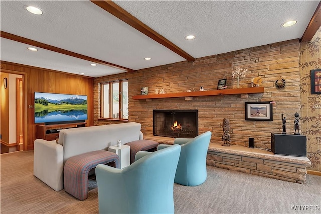 9325 Hunting Valley Rd N, Clarence, NY 14031 - living room featuring a textured ceiling, a stone fireplace, beamed ceiling, wooden walls, and recessed lighting