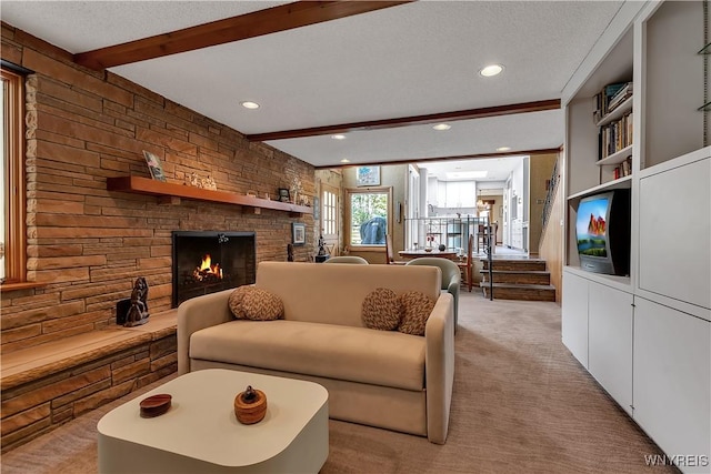 9325 Hunting Valley Rd N, Clarence, NY 14031 - living room featuring beam ceiling, a large fireplace, light colored carpet, recessed lighting, and a textured ceiling