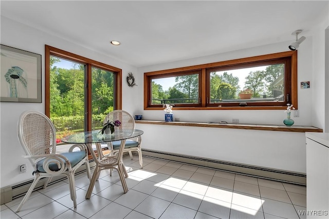 9325 Hunting Valley Rd N, Clarence, NY 14031 - dining space with plenty of natural light, a baseboard radiator, light tile patterned floors, and recessed lighting