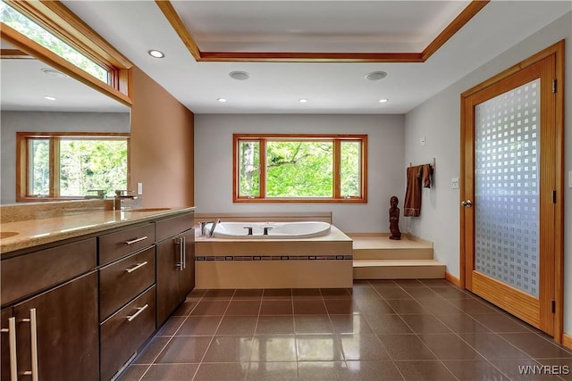 9325 Hunting Valley Rd N, Clarence, NY 14031 - full bath featuring a garden tub, double vanity, recessed lighting, and a tray ceiling