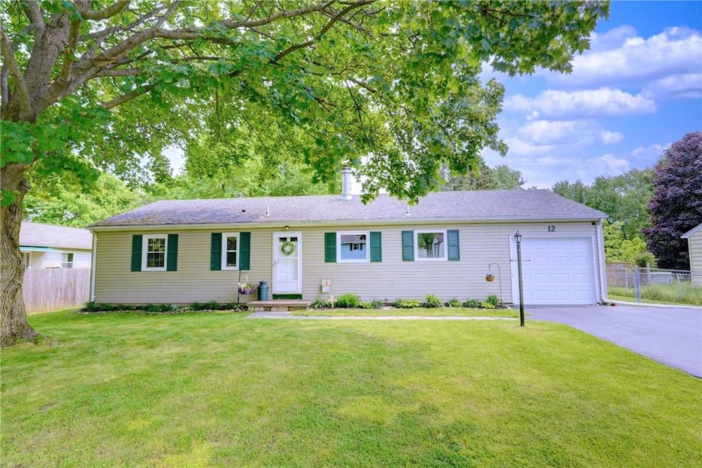 12 Buffalo Horn Cir, Henrietta, NY 14467 - single story home featuring an attached garage, driveway, and a chimney