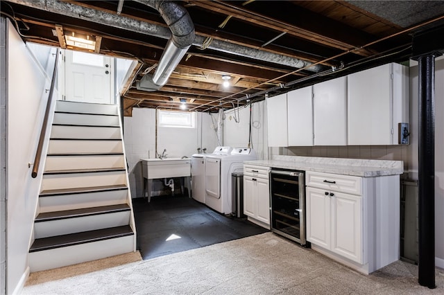 908 Winona Blvd, Irondequoit, NY 14617 - below grade area featuring washer and clothes dryer, beverage cooler, stairs, and carpet flooring
