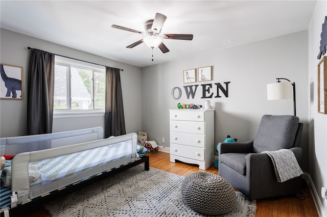 908 Winona Blvd, Irondequoit, NY 14617 - bedroom featuring wood finished floors, ceiling fan, and baseboards