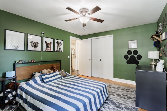 908 Winona Blvd, Irondequoit, NY 14617 - bedroom with wood finished floors, ceiling fan, a closet, and baseboards