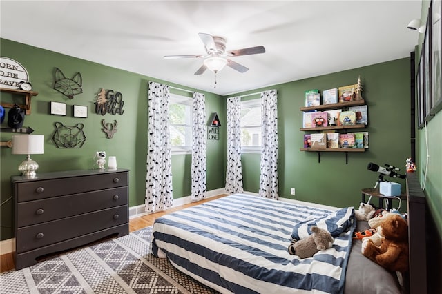 908 Winona Blvd, Irondequoit, NY 14617 - bedroom featuring baseboards, wood finished floors, and a ceiling fan