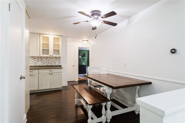 908 Winona Blvd, Irondequoit, NY 14617 - dining space with ceiling fan, dark wood-style flooring, and baseboards