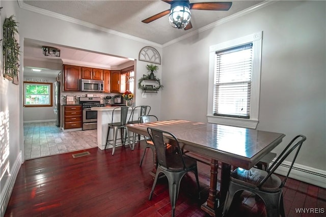 2019 Center St, North Collins, NY 14111 - dining room featuring wood-type flooring, a ceiling fan, ornamental molding, baseboards, and baseboard heating