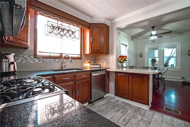 2019 Center St, North Collins, NY 14111 - kitchen featuring stainless steel dishwasher, a sink, ornamental molding, a peninsula, and brown cabinetry