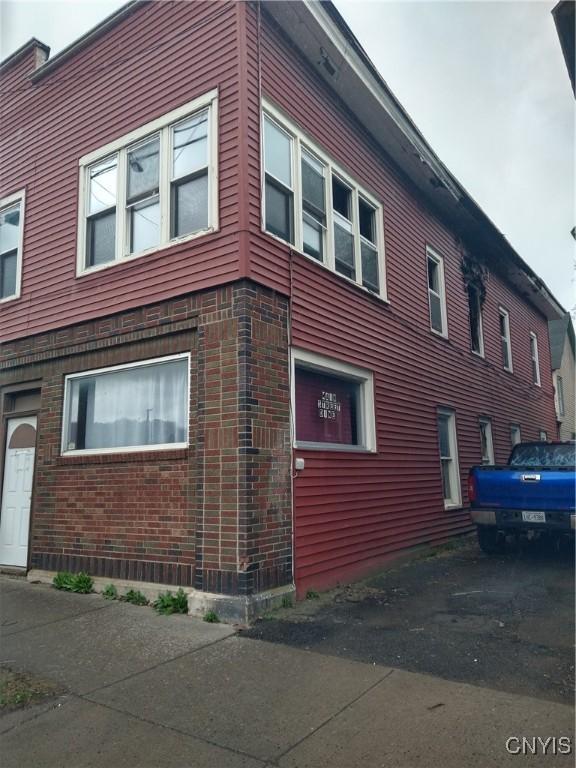 188 Main St, Cortland, NY 13045 - view of side of property with brick siding