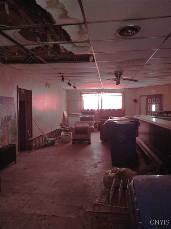 188 Main St, Cortland, NY 13045 - miscellaneous room featuring ceiling fan and wooden walls