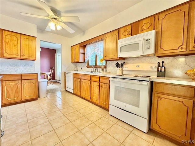 10 Litwak St, Fulton, NY 13069 - kitchen featuring white appliances, brown cabinetry, light countertops, decorative backsplash, and a ceiling fan