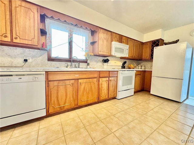 10 Litwak St, Fulton, NY 13069 - kitchen with white appliances, a sink, light countertops, tasteful backsplash, and brown cabinets