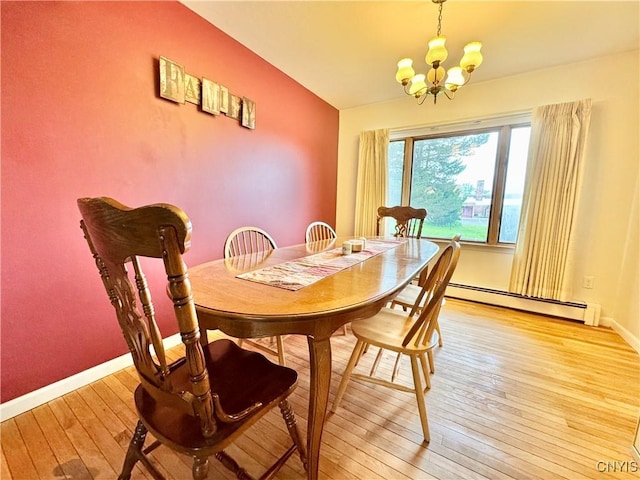 10 Litwak St, Fulton, NY 13069 - dining space featuring a baseboard radiator, light wood-type flooring, a chandelier, and baseboards