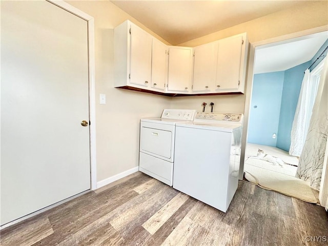 10 Litwak St, Fulton, NY 13069 - laundry area featuring cabinet space, separate washer and dryer, and wood finished floors