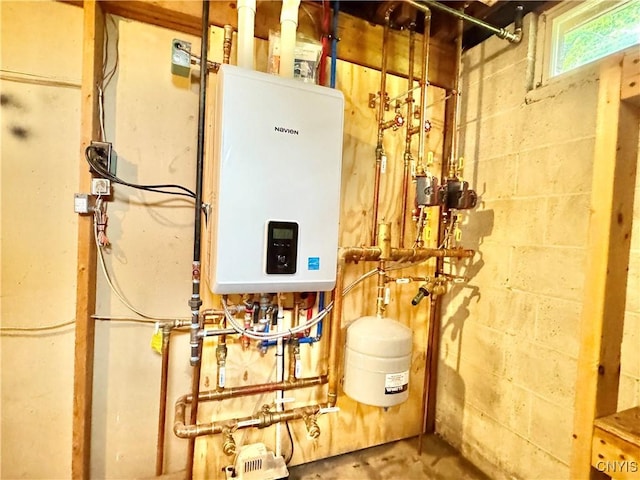10 Litwak St, Fulton, NY 13069 - utility room featuring tankless water heater
