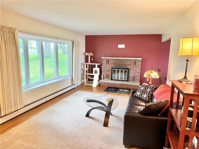 10 Litwak St, Fulton, NY 13069 - living room with a baseboard heating unit and wood finished floors
