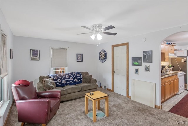 7-9 Tappan St Unit 7, Van Buren, NY 13027 - living area featuring arched walkways, ceiling fan, and light colored carpet