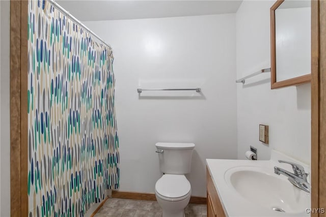 7-9 Tappan St Unit 7, Van Buren, NY 13027 - bathroom with toilet, vanity, a shower with shower curtain, baseboards, and tile patterned flooring