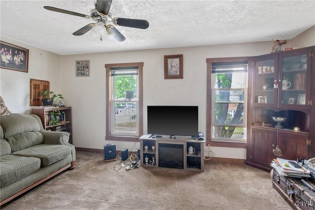 7-9 Tappan St Unit 7, Van Buren, NY 13027 - carpeted living room featuring a textured ceiling, baseboards, and ceiling fan