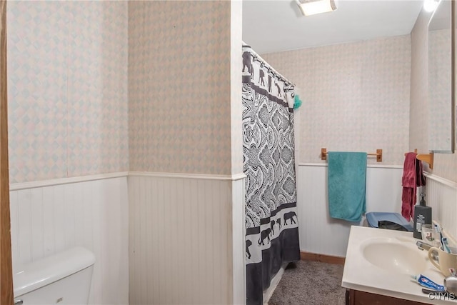 7-9 Tappan St Unit 7, Van Buren, NY 13027 - full bathroom featuring wallpapered walls, wainscoting, toilet, vanity, and a shower with curtain