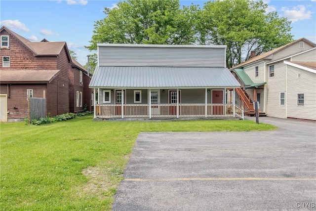 7-9 Tappan St Unit 7, Van Buren, NY 13027 - view of front of property with covered porch, a front yard, and metal roof