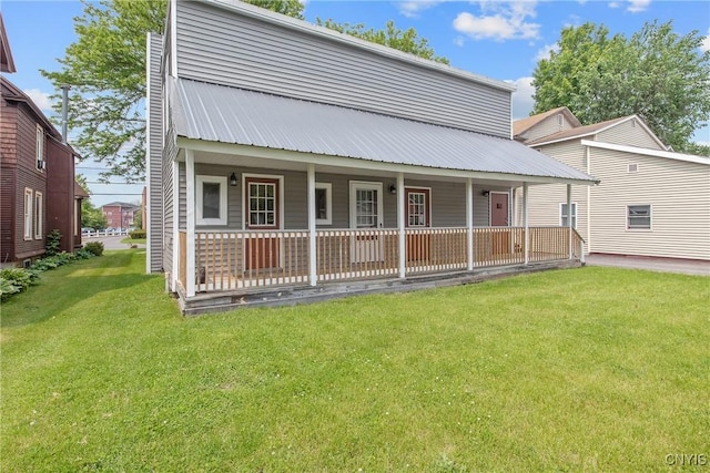 7-9 Tappan St Unit 7, Van Buren, NY 13027 - rear view of house with covered porch, a lawn, and metal roof