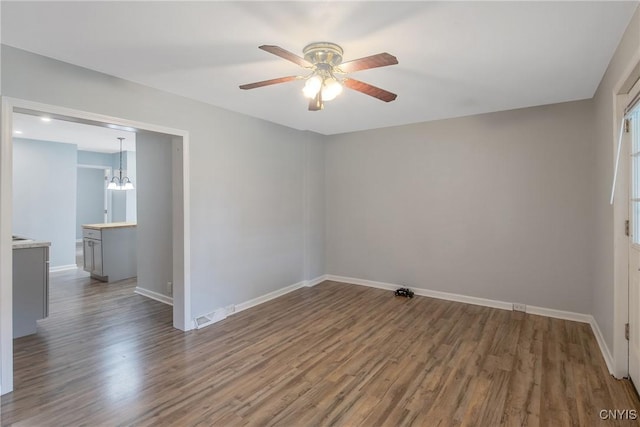 7-9 Tappan St Unit 7, Van Buren, NY 13027 - empty room featuring a ceiling fan, wood finished floors, baseboards, and a chandelier