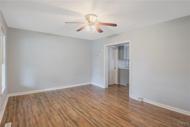 7-9 Tappan St Unit 7, Van Buren, NY 13027 - spare room featuring ceiling fan, wood finished floors, baseboards, and a sink