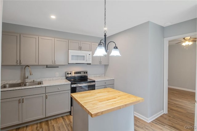 7-9 Tappan St Unit 7, Van Buren, NY 13027 - kitchen with white microwave, gray cabinetry, a sink, stainless steel range with electric cooktop, and wood counters