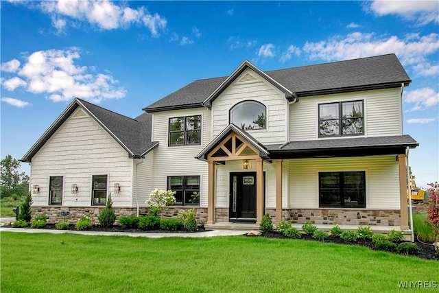 4 Streamsong Ct, Amherst, NY 14051 - view of front facade with a front yard, stone siding, a porch, and a shingled roof