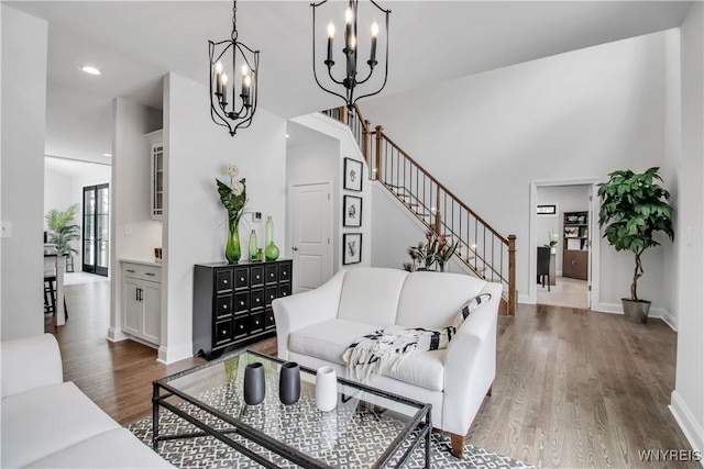 4 Streamsong Ct, Amherst, NY 14051 - living area with a chandelier, wood finished floors, baseboards, recessed lighting, and stairway