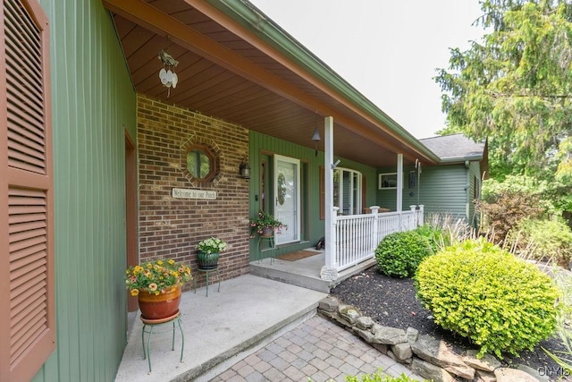 2260 Lamson Rd, Lysander, NY 13135 - entrance to property featuring a porch and brick siding