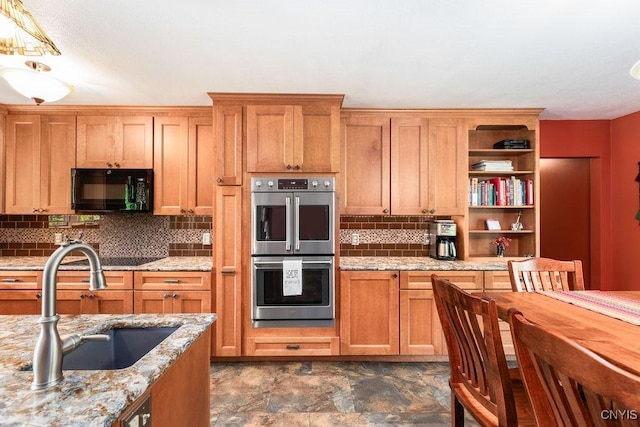 2260 Lamson Rd, Lysander, NY 13135 - kitchen featuring black appliances, a sink, tasteful backsplash, open shelves, and brown cabinets