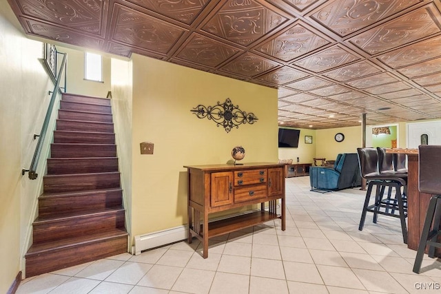 2260 Lamson Rd, Lysander, NY 13135 - stairs featuring tile patterned floors, baseboard heating, and baseboards