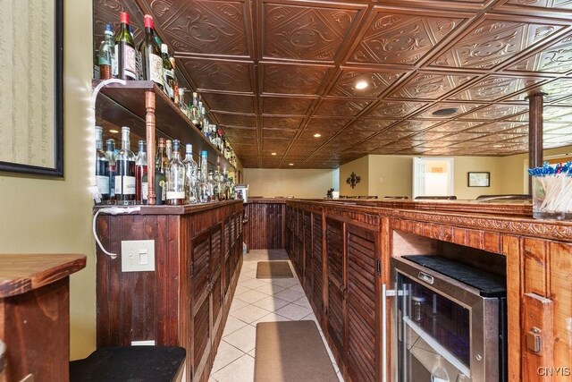 2260 Lamson Rd, Lysander, NY 13135 - indoor dry bar with light tile patterned floors and wine cooler