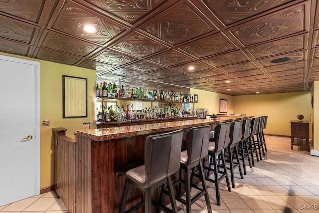 2260 Lamson Rd, Lysander, NY 13135 - community bar area with light tile patterned flooring, an ornate ceiling, and baseboards