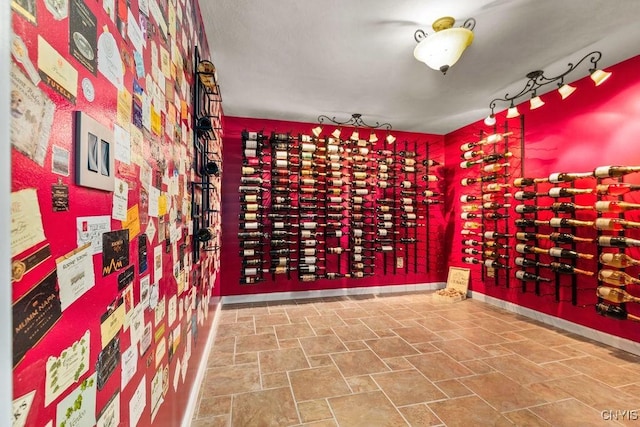 2260 Lamson Rd, Lysander, NY 13135 - wine room with stone finish flooring and baseboards