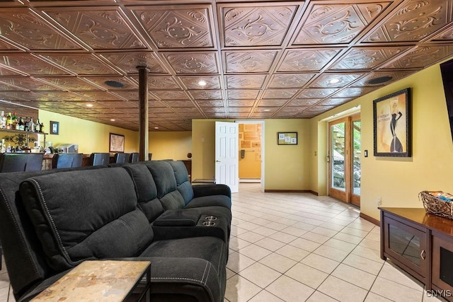 2260 Lamson Rd, Lysander, NY 13135 - living area featuring light tile patterned flooring, baseboards, an ornate ceiling, and a bar