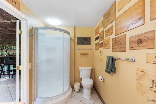 2260 Lamson Rd, Lysander, NY 13135 - bathroom with tile patterned floors, toilet, and a stall shower