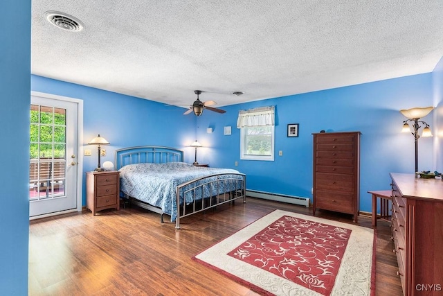 2260 Lamson Rd, Lysander, NY 13135 - bedroom with a baseboard heating unit, a textured ceiling, access to exterior, wood finished floors, and a ceiling fan