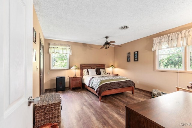 2260 Lamson Rd, Lysander, NY 13135 - bedroom featuring wood finished floors, a textured ceiling, ceiling fan, and baseboards