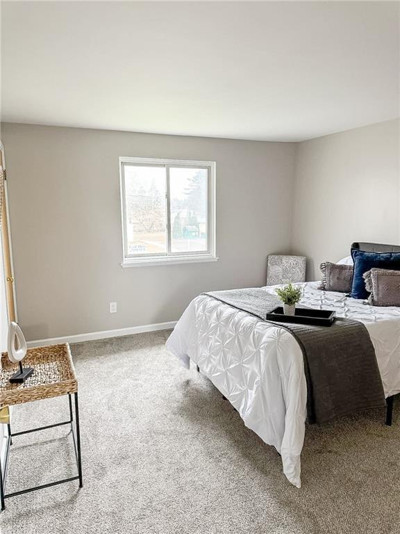 90 Fox Run, Gates, NY 14606 - carpeted bedroom featuring baseboards