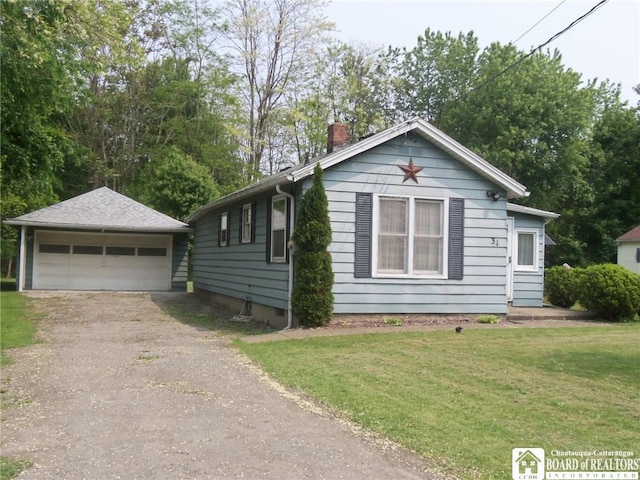 31 Matteson St, Pomfret, NY 14063 - view of front facade featuring an outdoor structure, a chimney, a garage, and a front yard