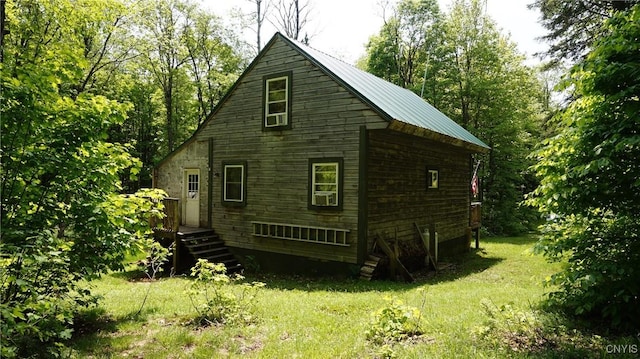 1507 Keeney Ln, Osceola, NY 13437 - view of property exterior with a lawn and metal roof