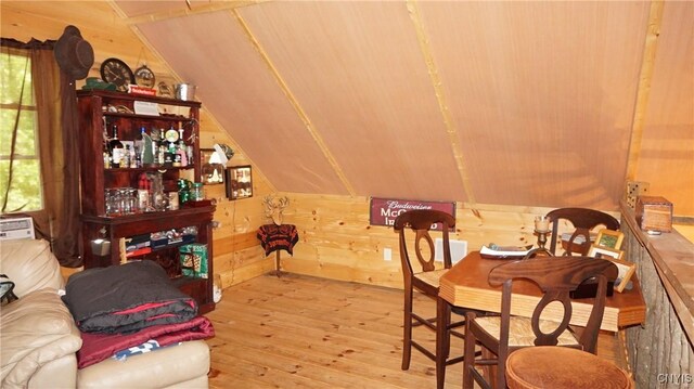 1507 Keeney Ln, Osceola, NY 13437 - dining room with hardwood / wood-style floors, lofted ceiling, and wooden walls