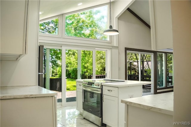 1763 Lake Rd, Porter, NY 14174 - kitchen with electric stove, light marble finish flooring, white cabinetry, a towering ceiling, and pendant lighting