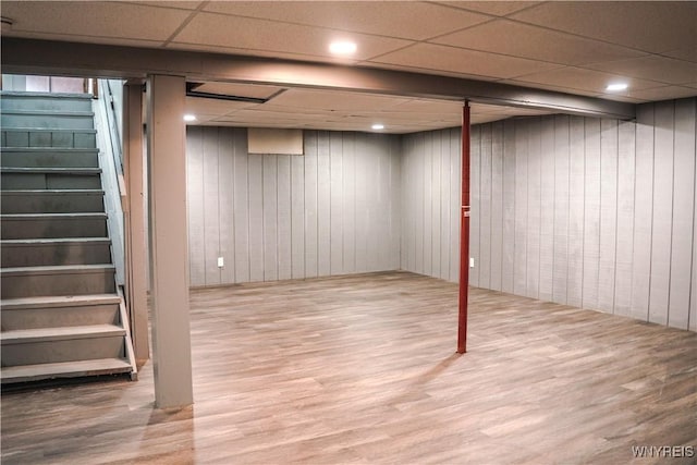 1763 Lake Rd, Porter, NY 14174 - finished below grade area featuring stairway, wood finished floors, a paneled ceiling, wood walls, and recessed lighting