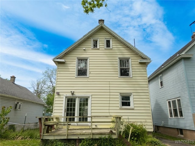 2215 S Ave, Niagara Falls, NY 14305 - rear view of property with a wooden deck and a chimney