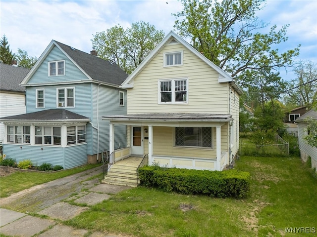 2215 S Ave, Niagara Falls, NY 14305 - traditional-style house featuring covered porch and a front lawn